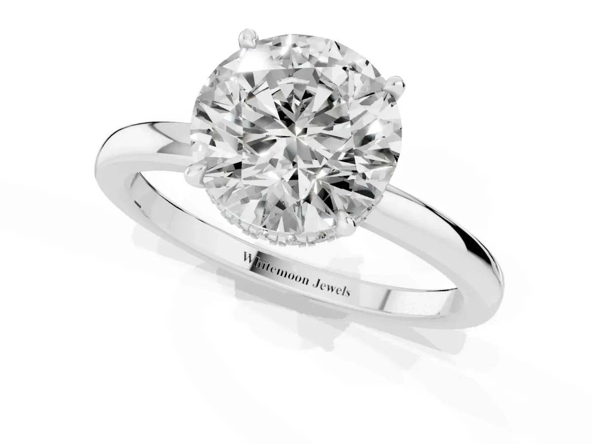 Round Cut Solitaire Engagement Ring with Cathedral Band and Four-Prong Setting Silver