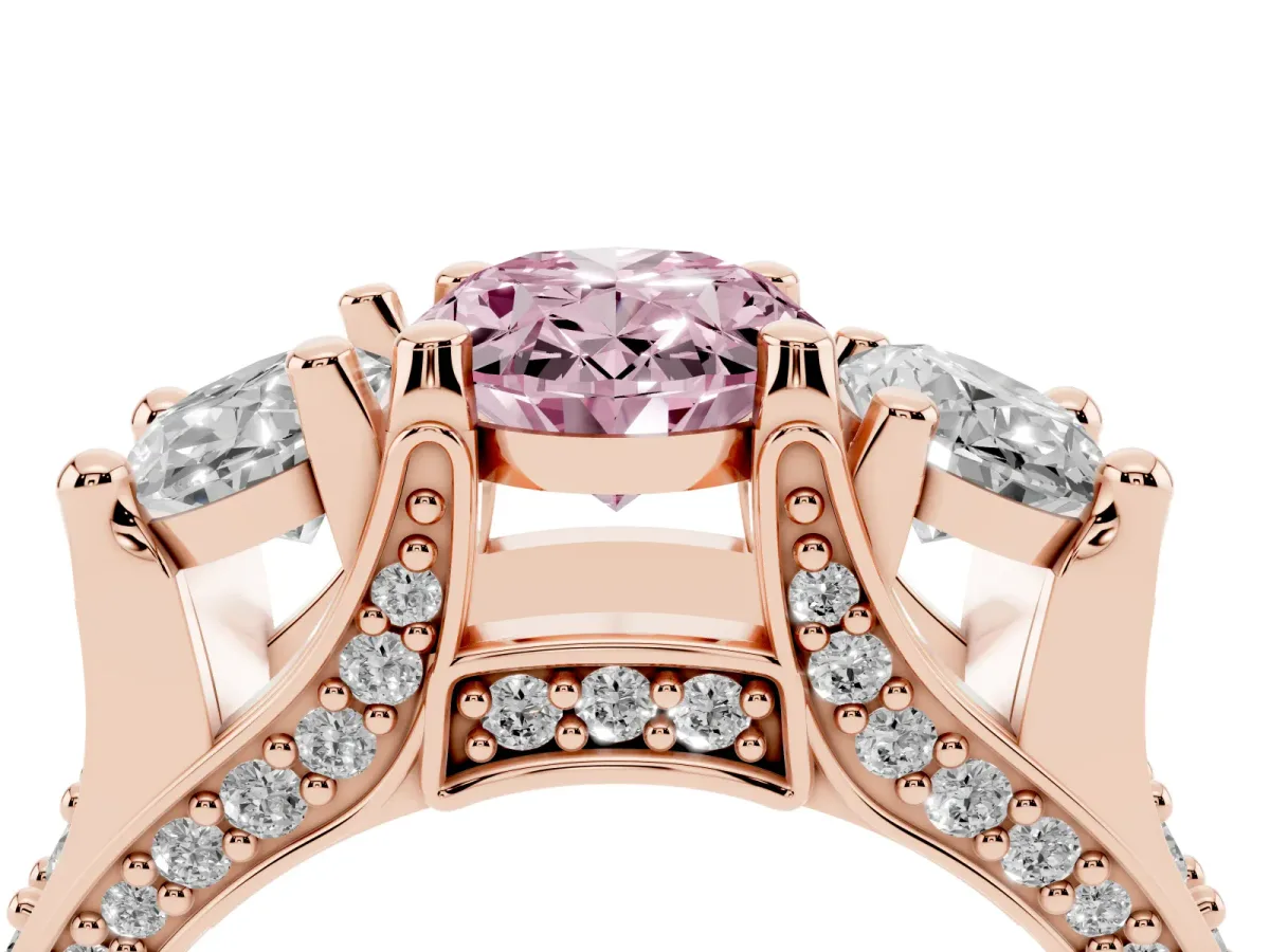 Fancy Pink Oval Cut Diamond Three-Stone Ring with Channel Set Band and Four-Prong Setting Rose gold