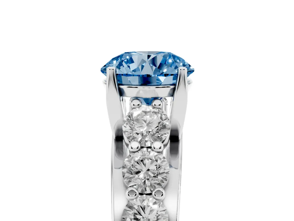 Fancy Blue Round Cut Diamond Engagement Ring with Pavé Band and Four-Prong Setting Silver