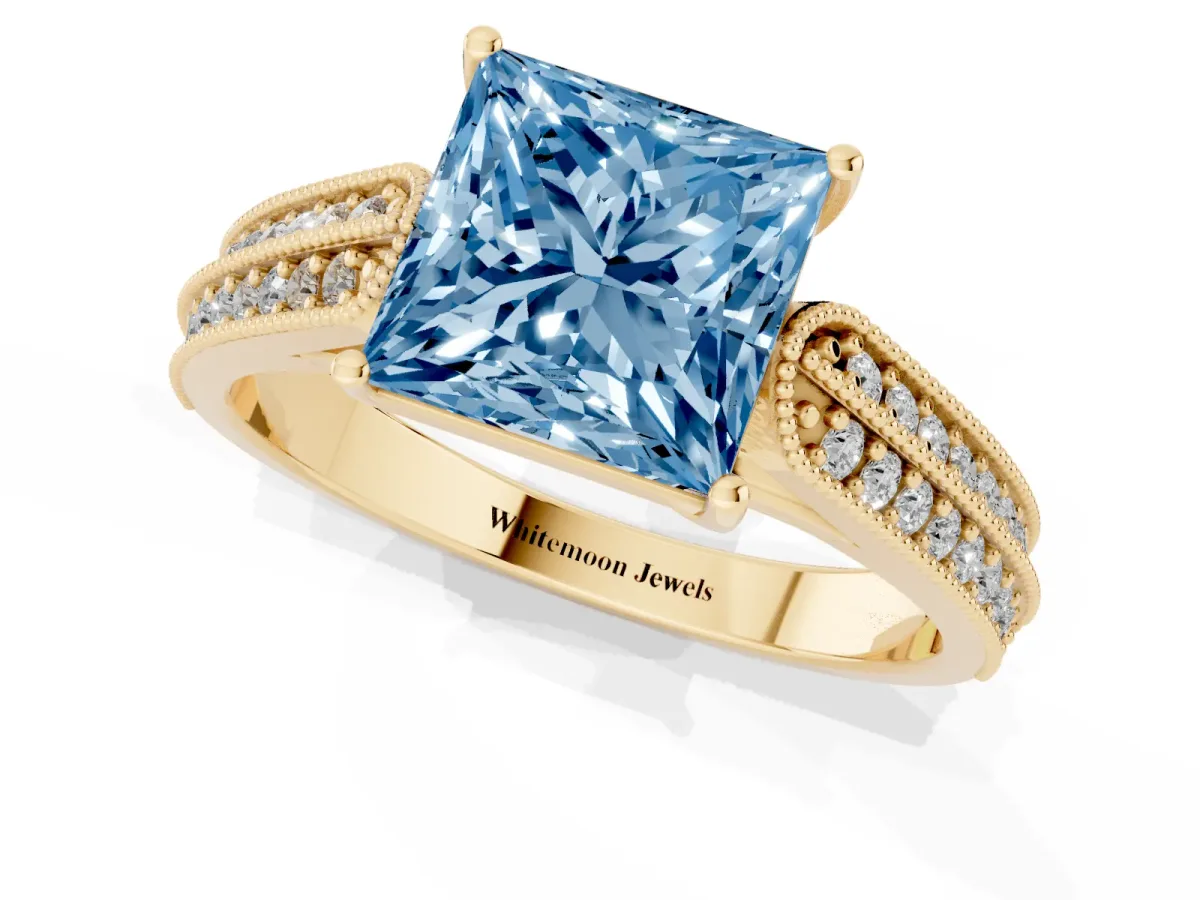 Fancy Blue Princess Cut Cut Pave Split Shank Engagement Ring with Four-Prong Setting Yellow gold