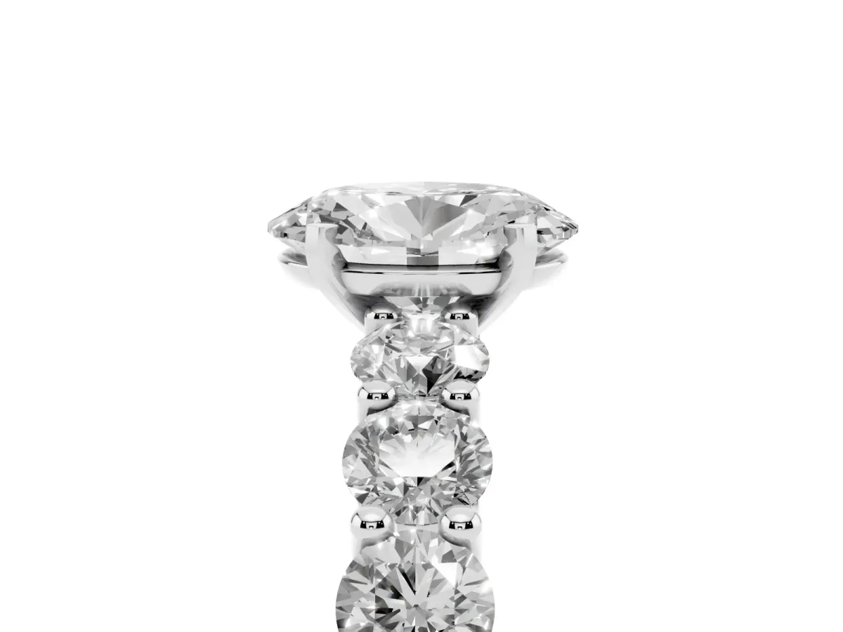 Oval Cut Diamond Prong Setting with Side Stones on a Pave Band Silver