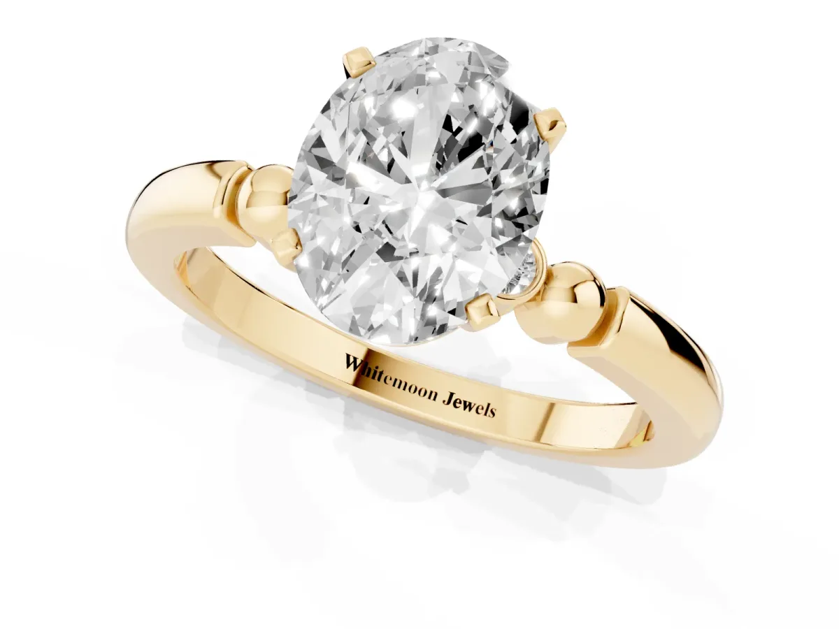 Oval Cut Solitaire Beaded Band with Four-Prong Setting Yellow gold