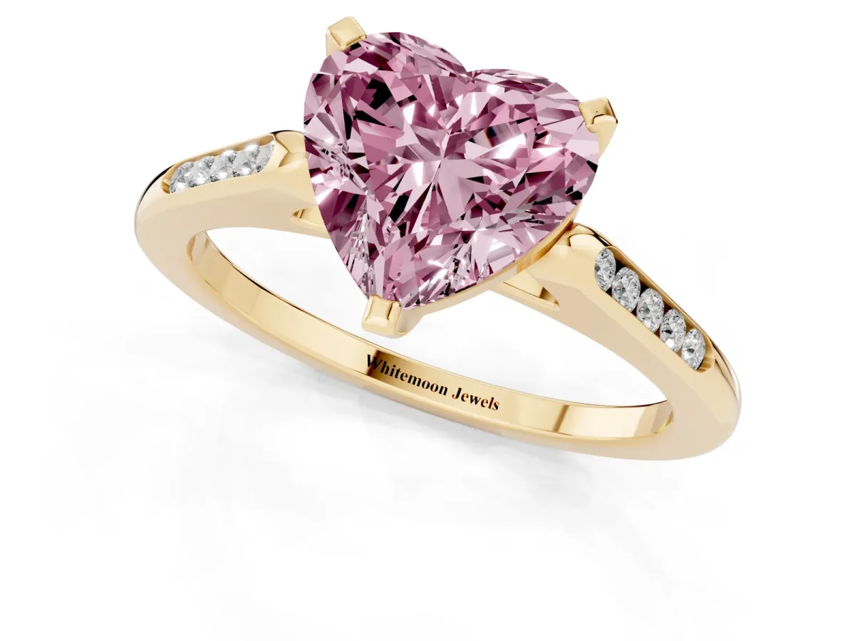 Fancy Pink Heart Cut Diamond Solitaire Ring with Channel Set Round Band and Prong Setting Yellow gold
