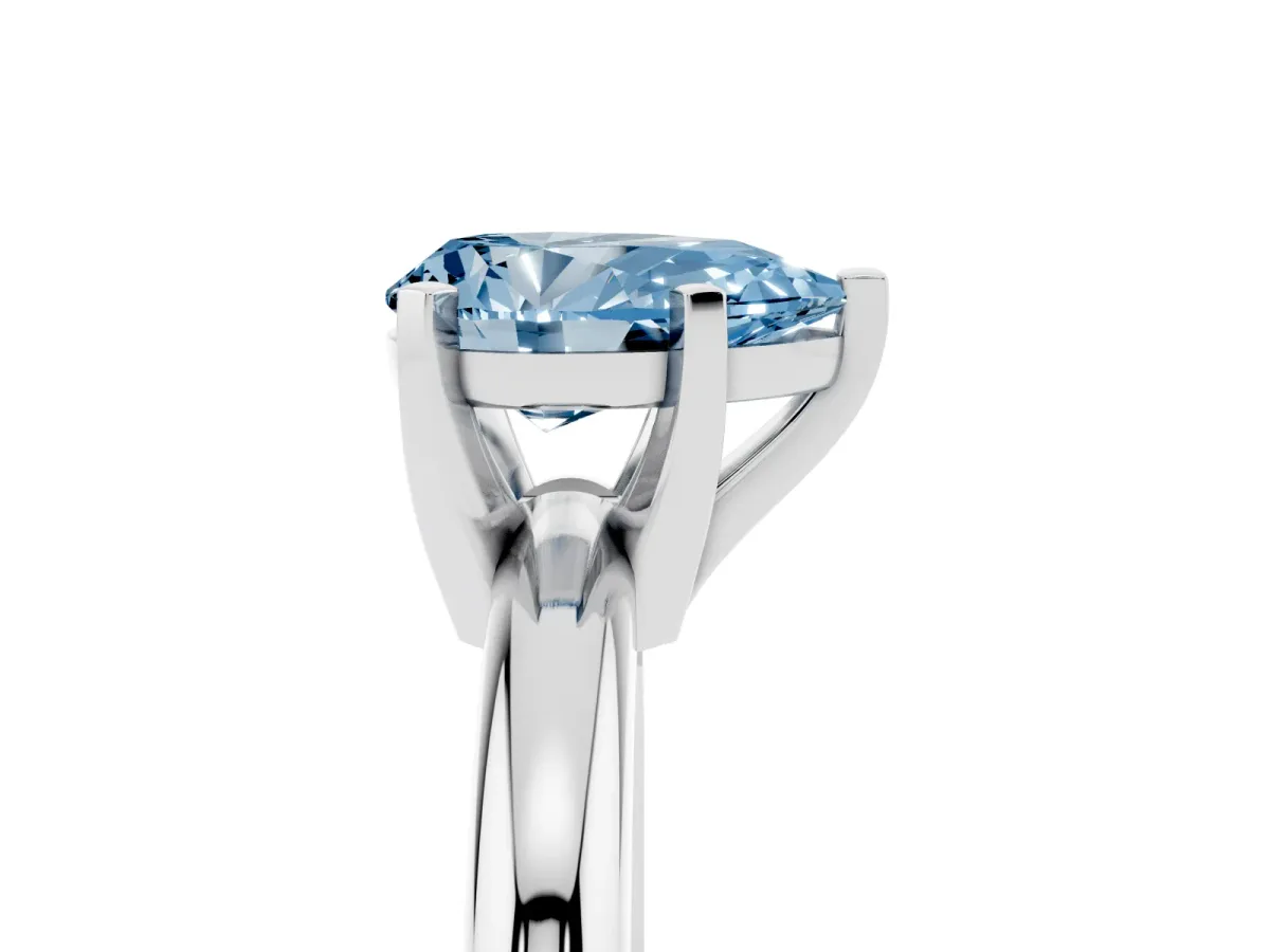 Fancy Blue Pear Cut Diamond Solitaire Engagement Ring with Round Band and Four-Prong Setting Silver