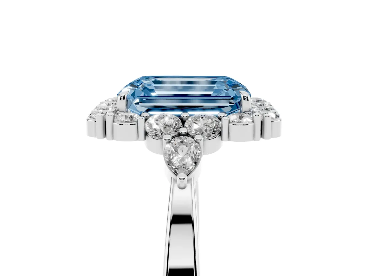 Fancy Blue Emerald Cut Diamond Halo Ring with Pear Side Stones and Prong Setting Platinum