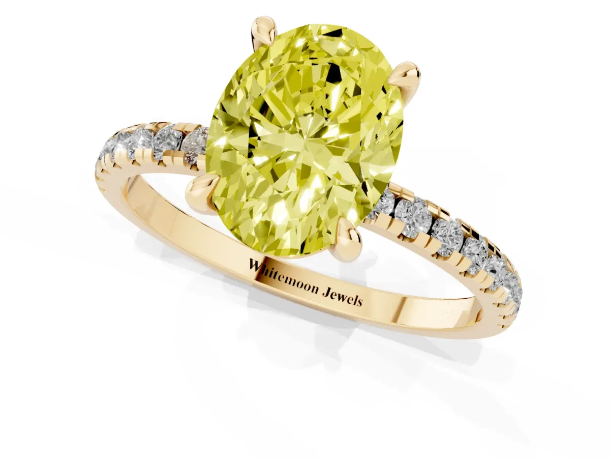 Fancy Yellow Oval Cut Diamond Brilliant Solitaire Ring with Pavé Band and Four-Prong Setting Yellow gold