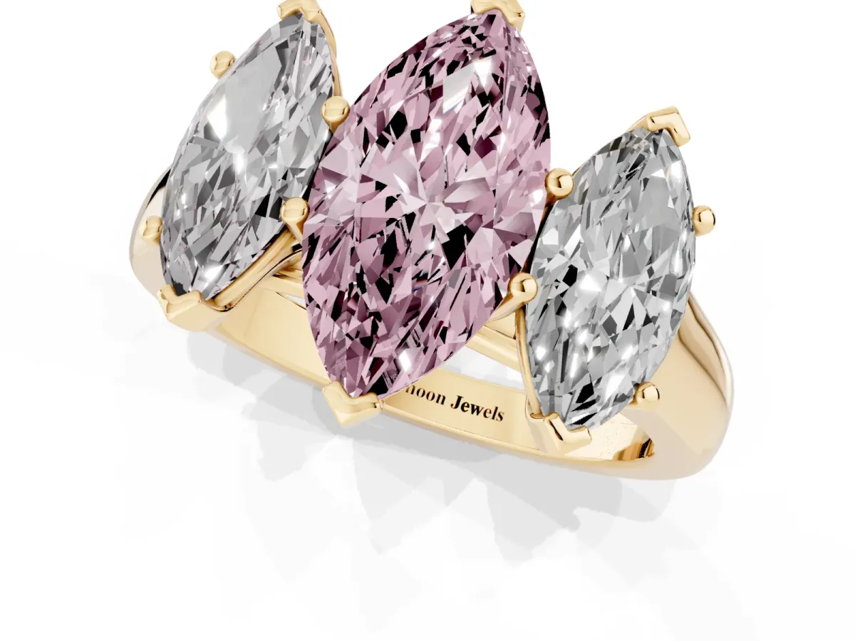 Fancy Pink Marquise Cut Three-Stone Diamond Ring with Prong Setting on a Classic Band Yellow gold