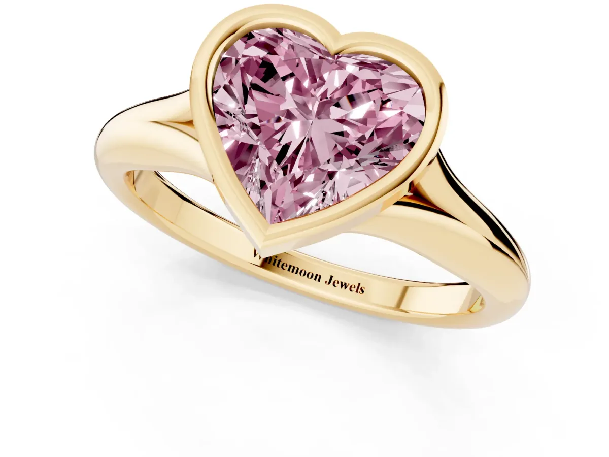Fancy Pink Bezel Set Heart Cut Solitaire Diamond Ring with Smooth Band Yellow gold
