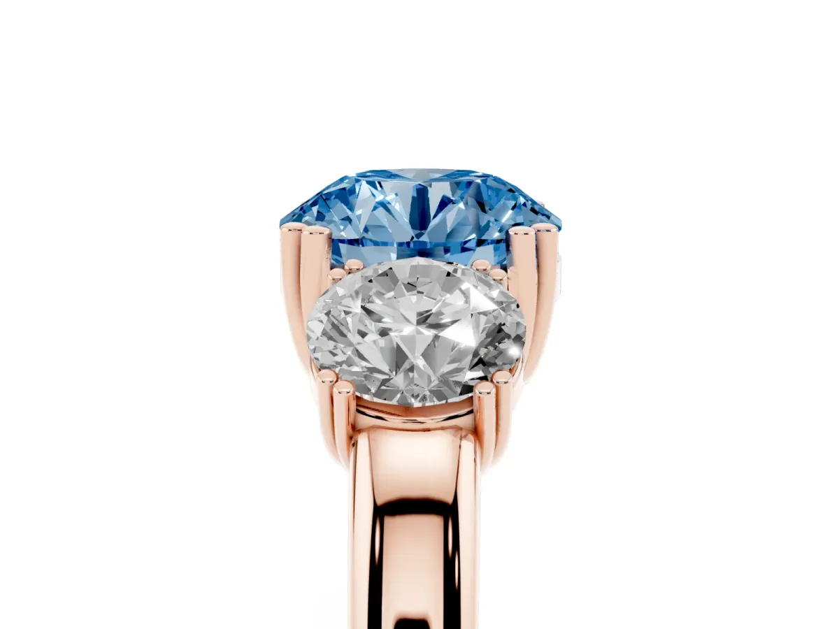Fancy Blue Three-Stone Round Cut Cut Diamond Ring with Channel Set Band and Four-Prong Setting Rose gold