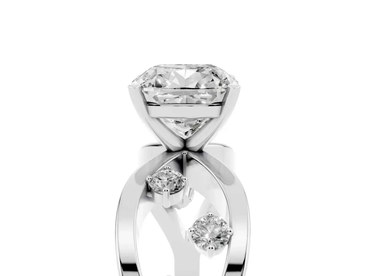 Cushion Cut Cut Solitaire Diamond with Side Stones on Criss-Cross Band and Four-Prong Setting Silver