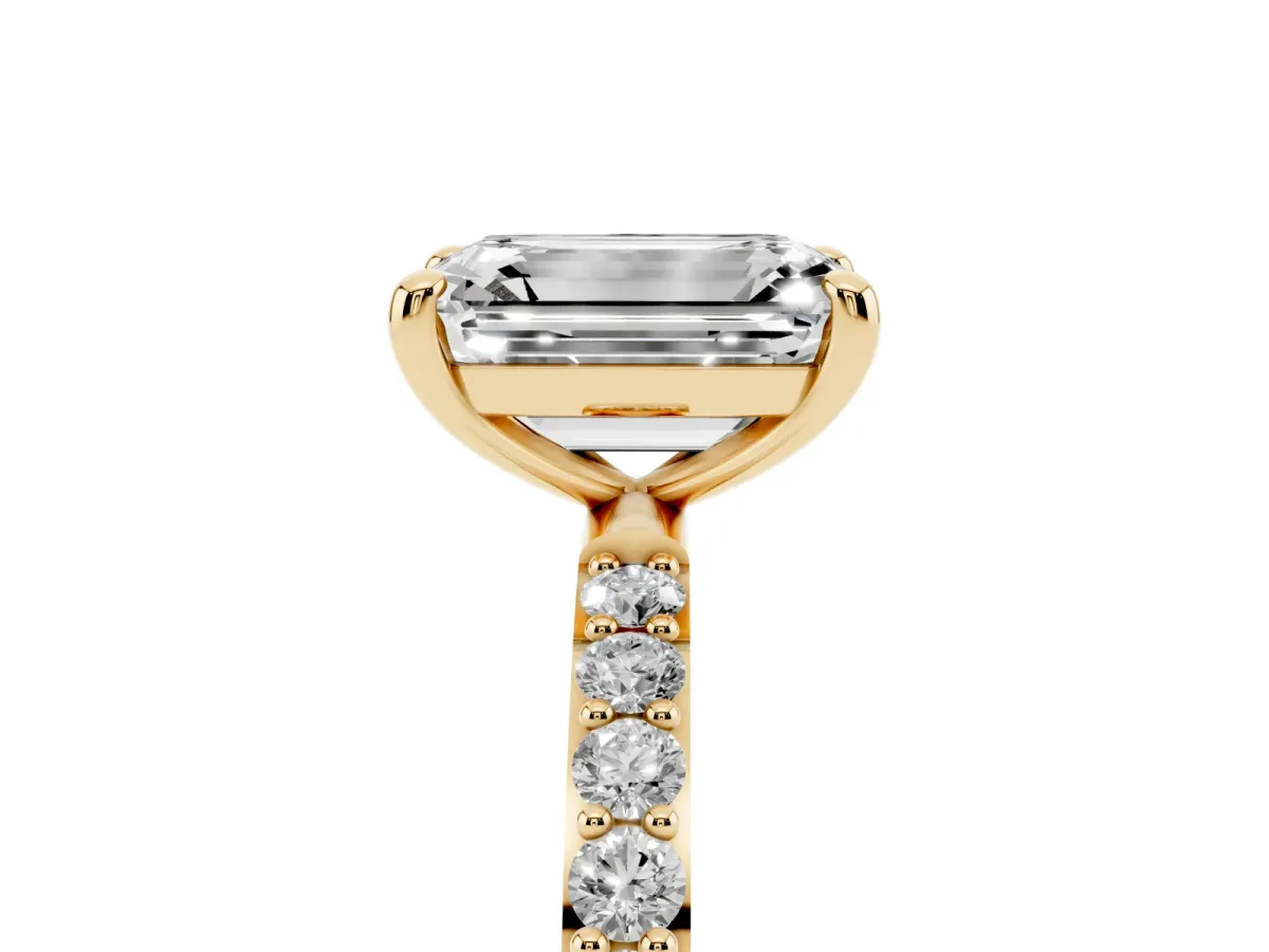 Emerald Cut Diamond Solitaire Ring with Round Pavé Band and Prong Setting Yellow gold