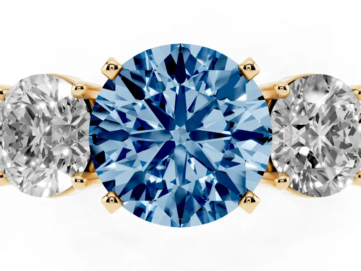 Fancy Blue Three-Stone Round Cut Diamond Ring with Round Side Stones, Classic Band, and Four-Prong Setting Yellow gold