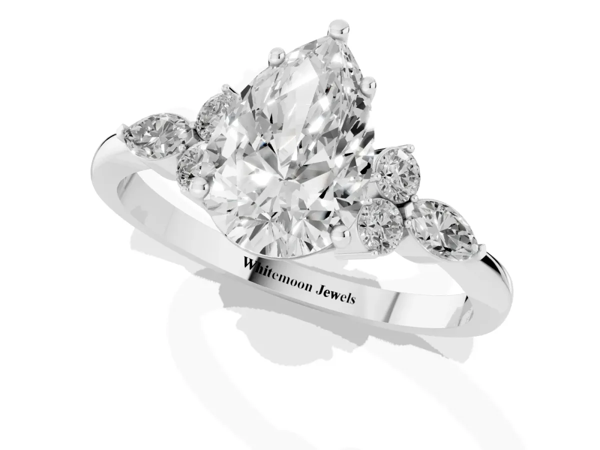 Pear Cut Brilliant Diamond Solitaire Ring with Pear Side Stones and Four-Prong Setting Silver
