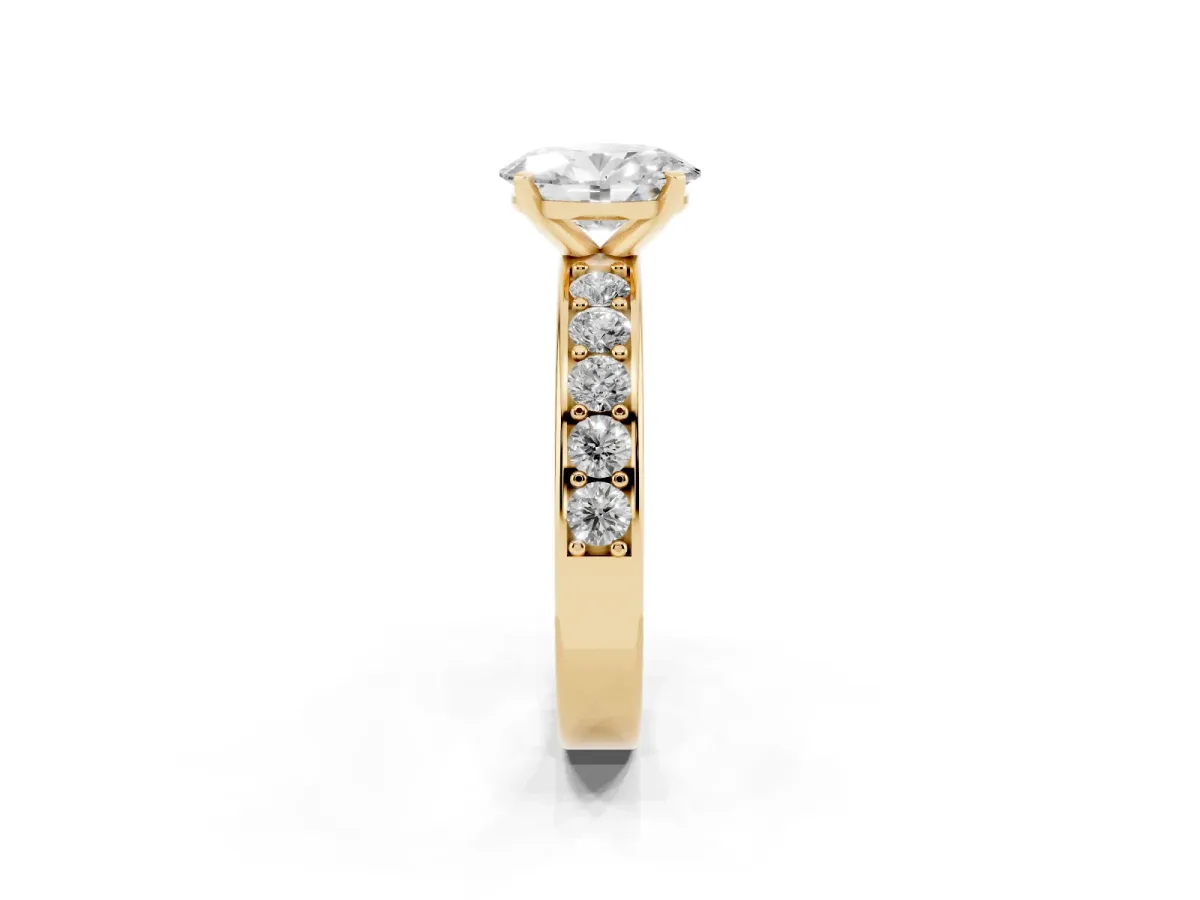 Oval Cut Diamond Engagement Ring with Channel Set Round Band and Prong Setting Yellow gold