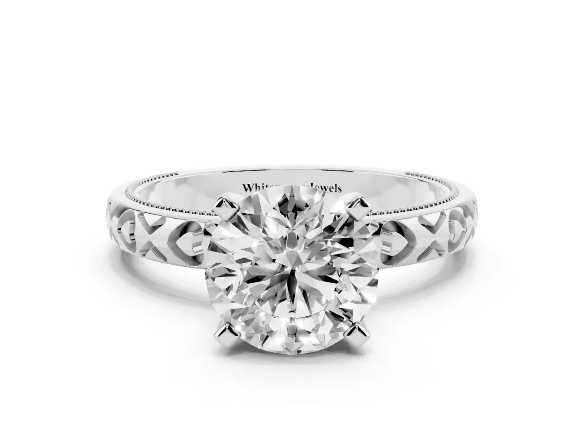Round Cut Solitaire Diamond Engagement Ring with XO Engraved Band and Four-Prong Setting Silver