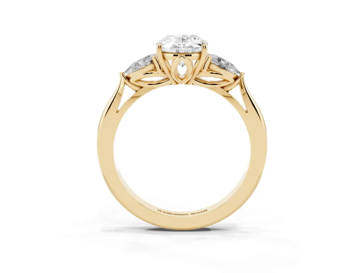Oval Cut Diamond Three-Stone Ring with Pear Side Stones and Prong Setting Yellow gold
