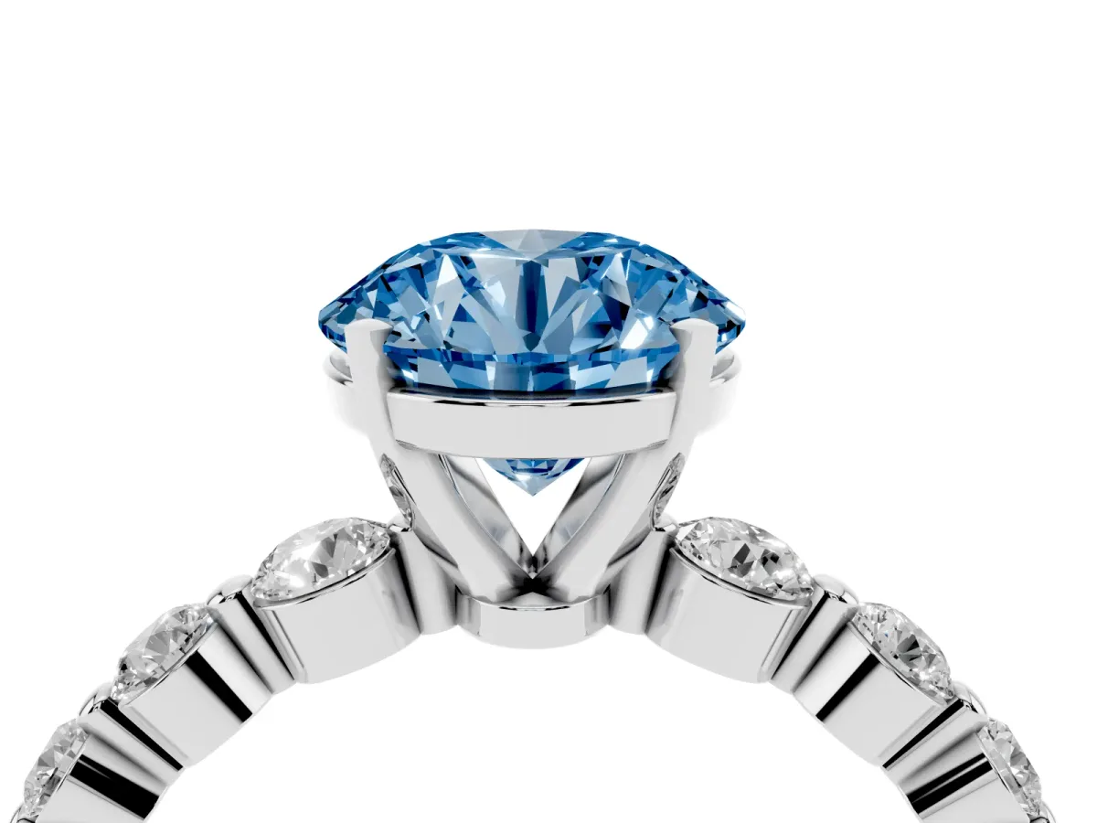 Fancy Blue Round Cut Solitaire Diamond Ring with Pave Band and Four-Prong Setting Silver