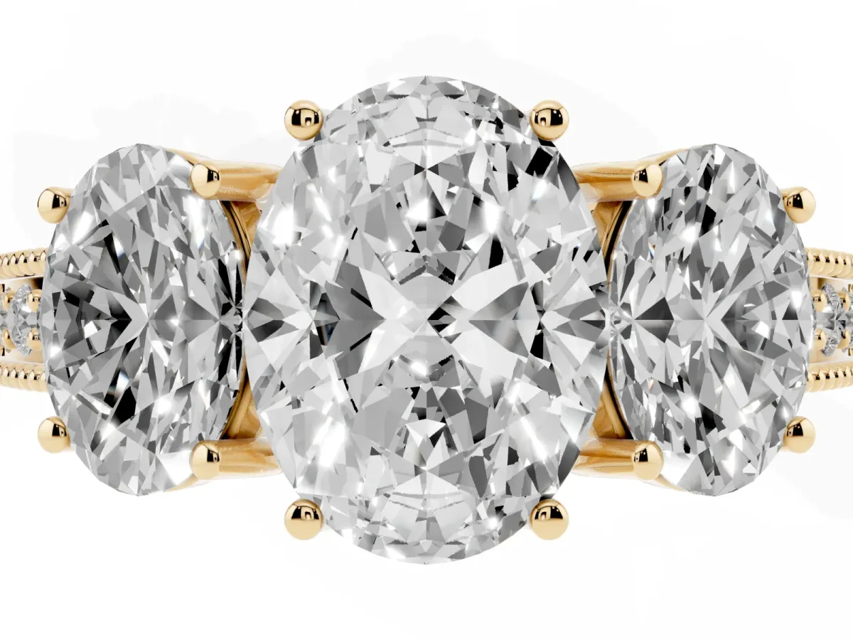Three-Stone Oval Cut Cut Milgrain Pavé Engagement Ring Yellow gold