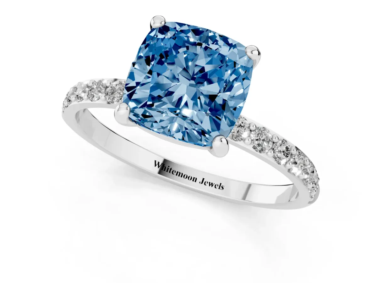 Fancy Blue Cushion Cut Diamond Solitaire Ring with Round Pavé Band and Prong Setting Silver