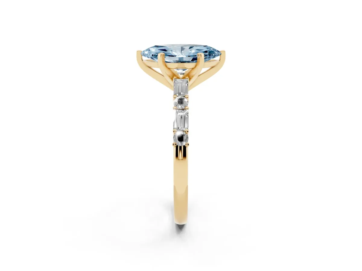 Fancy Blue Marquise Cut Diamond Solitaire with Side Baguettes and Channel Set Band Yellow gold