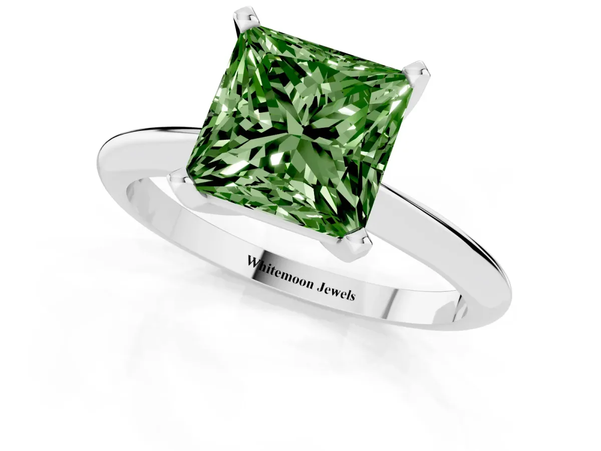 Fancy Green Princess Cut Cut Solitaire Ring with Four-Prong Setting on a Classic Band Silver