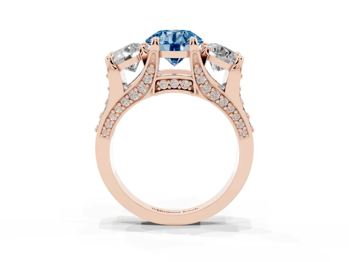 Fancy Blue Round Cut Diamond Three-Stone Ring with Channel Set Band and Four-Prong Setting Rose gold