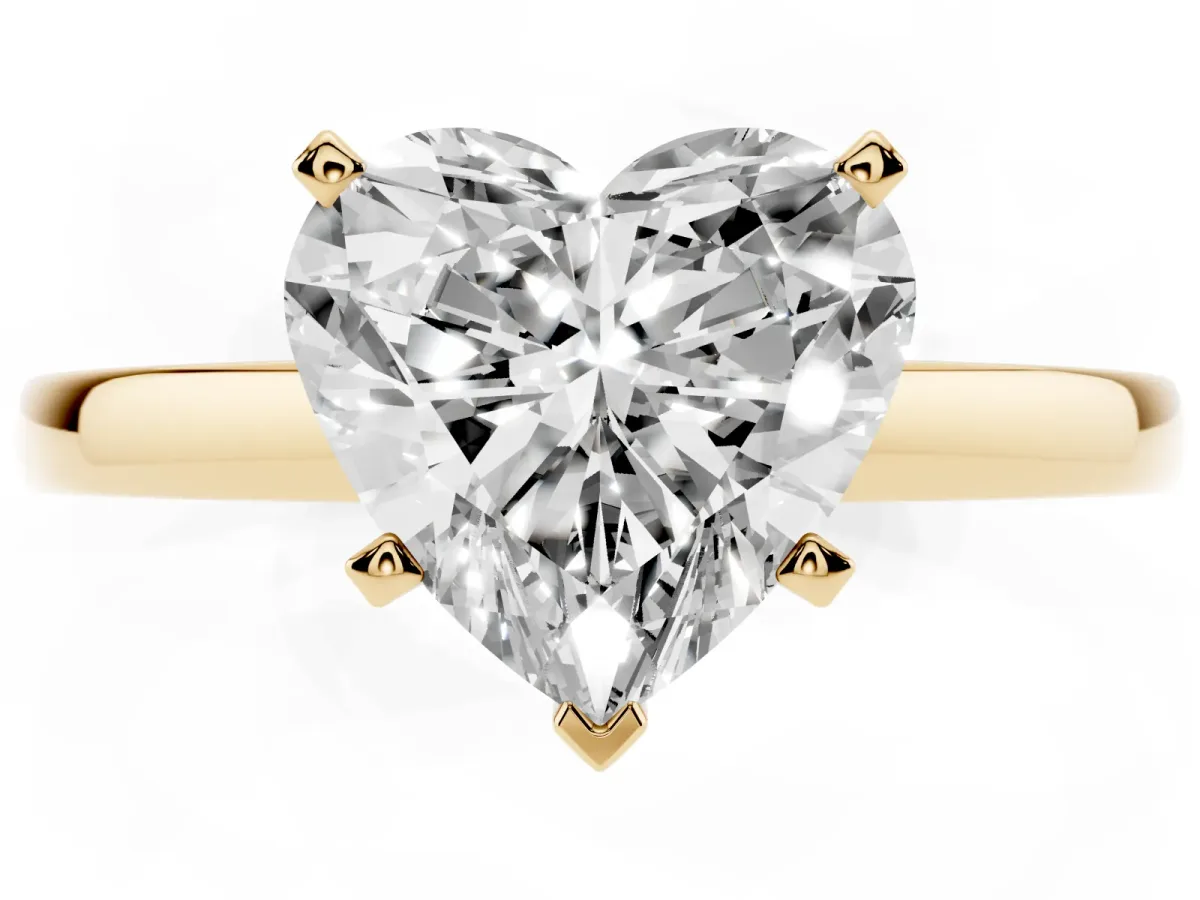 Heart Cut Solitaire Diamond Engagement Ring with Four-Prong Setting on a Classic Band Yellow gold