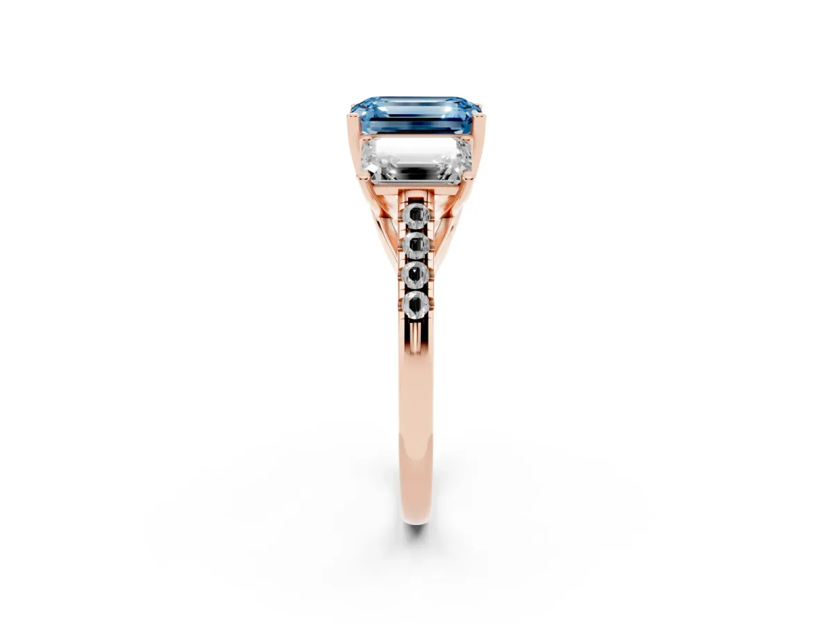 Fancy Blue Three-Stone Emerald Cut Diamond Ring with Round Pavé Band and Prong Setting Rose gold