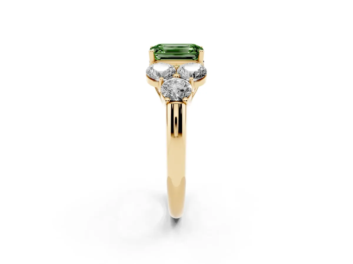 Fancy Green Emerald Cut Cut Diamond Cluster Ring with Round Accent Stones and Prong Setting on a Classic Band Yellow gold