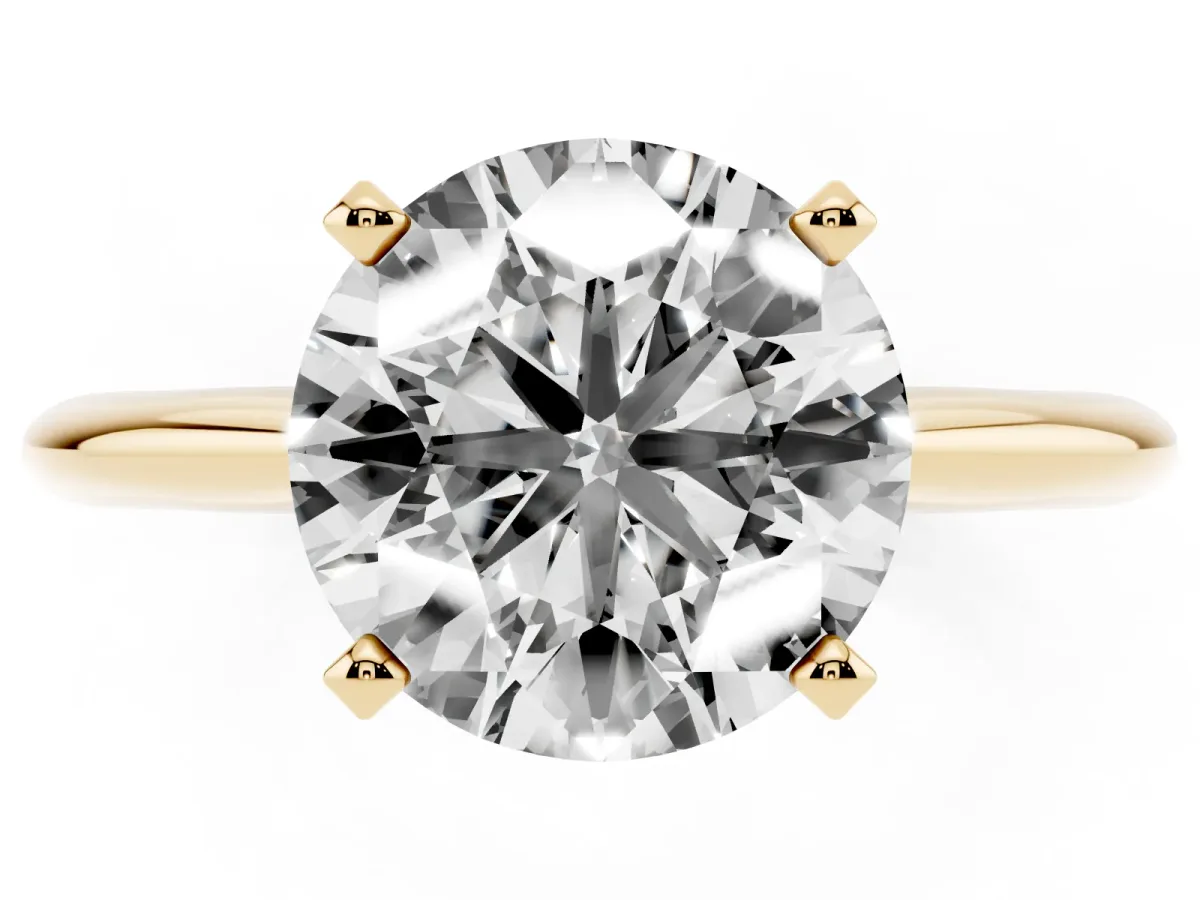Round Cut Cut Solitaire Ring with Four-Prong Setting on a Classic Band Yellow gold
