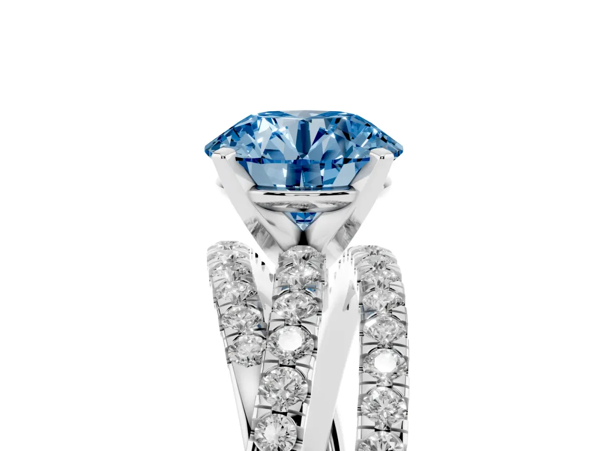Fancy Blue Round Cut Solitaire Twist Band with Pavé Setting and Four-Prong Setting Silver
