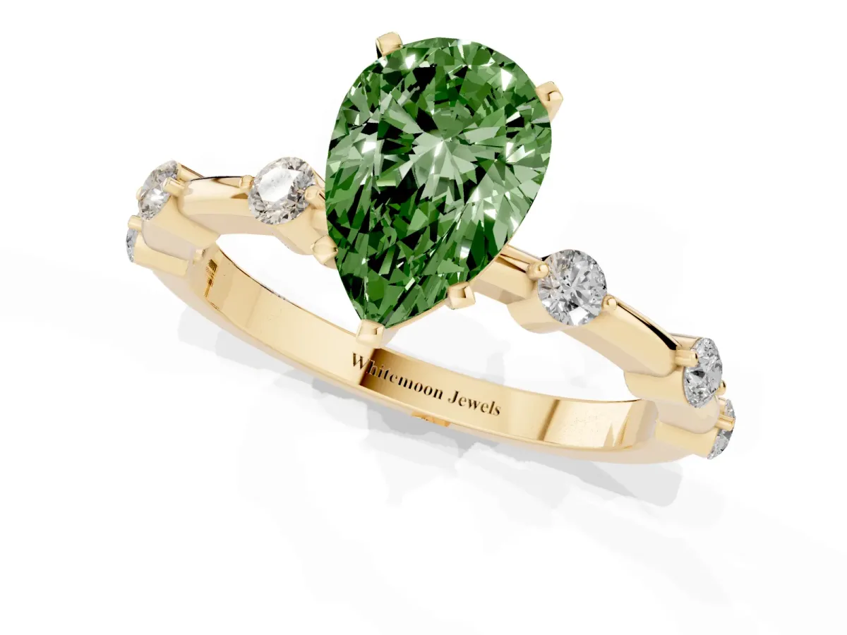 Fancy Green Pear Cut Solitaire Diamond Ring with Bezel Set Side Stones and Prong Setting Yellow gold