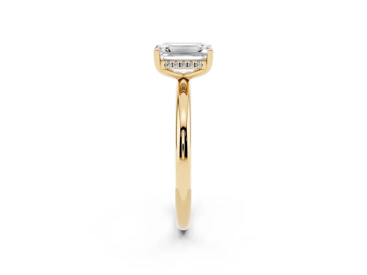 Emerald Cut Cut Solitaire Engagement Ring with Four-Prong Setting and Classic Band Yellow gold