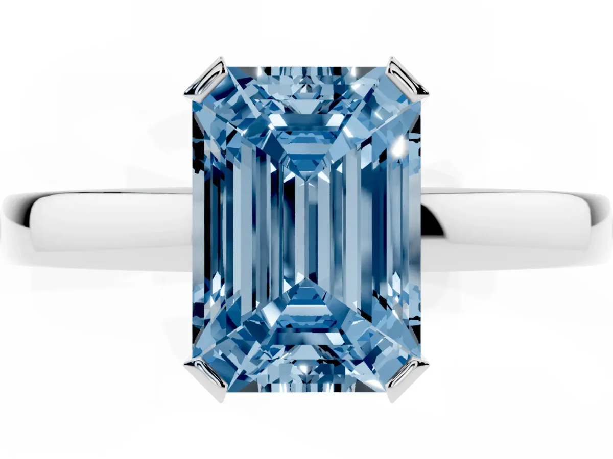 Fancy Blue Emerald Cut Cut Solitaire Ring with Four-Prong Setting and Classic Band Silver