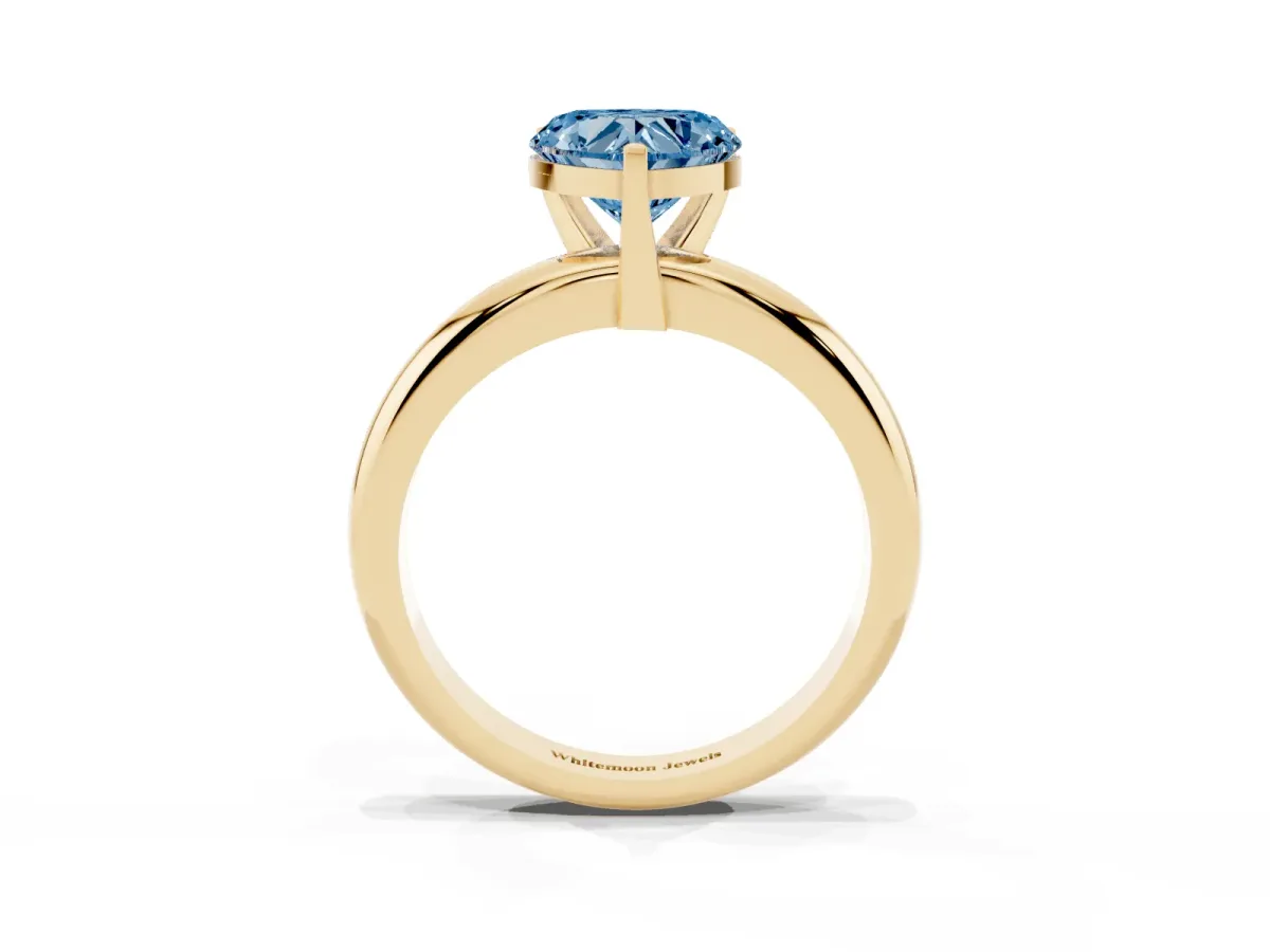 Fancy Blue Heart Cut Diamond Solitaire Engagement Ring with Round Band and Four-Prong Setting Yellow gold