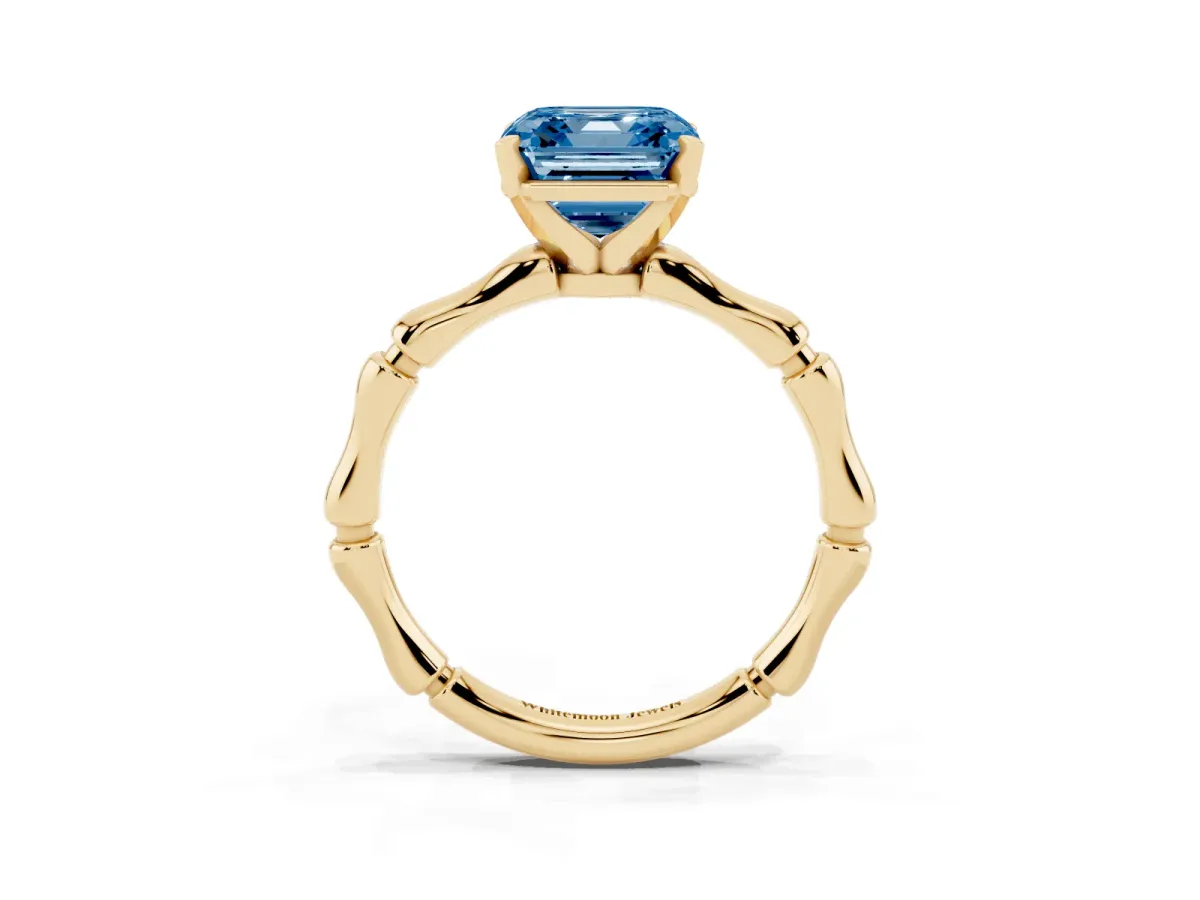 Fancy Blue Asscher Cut Solitaire Diamond Ring with Bamboo Band and Four-Prong Setting Yellow gold