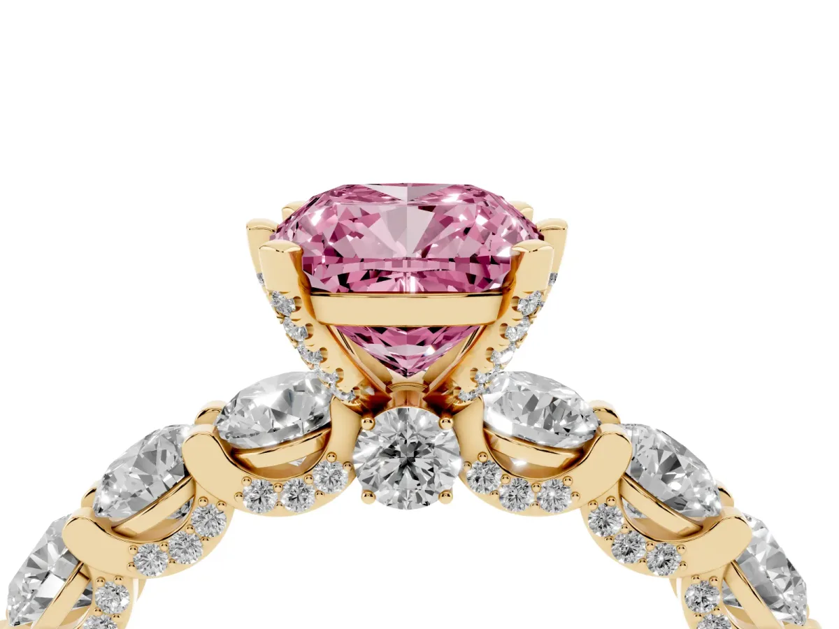 Fancy Pink Cushion Cut Diamond Side Stone Engagement Ring with Four-Prong Setting Yellow gold