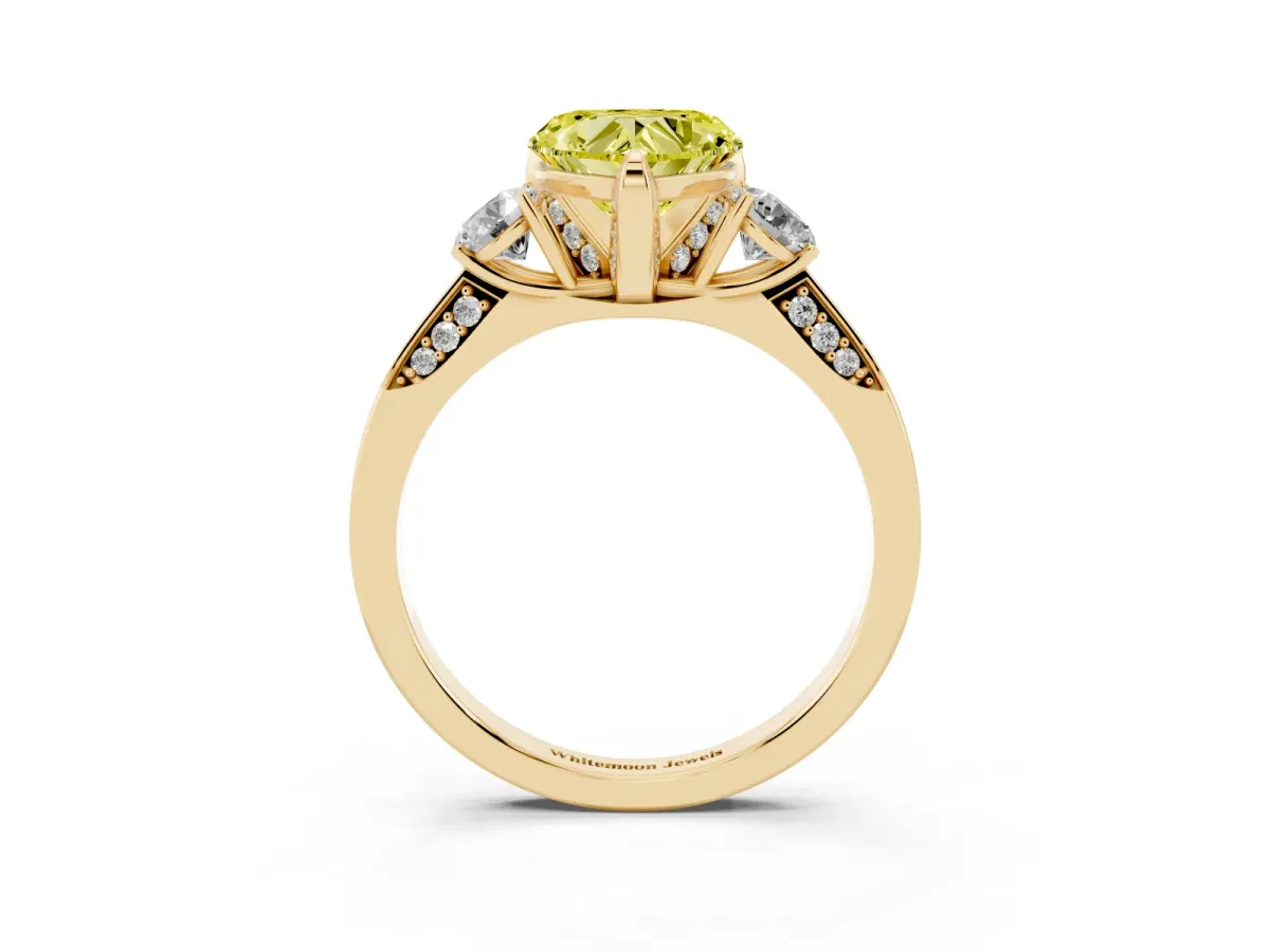 Fancy Yellow Heart Cut Brilliant Three-Stone Diamond Ring with Pavé Band and Four-Prong Setting Yellow gold