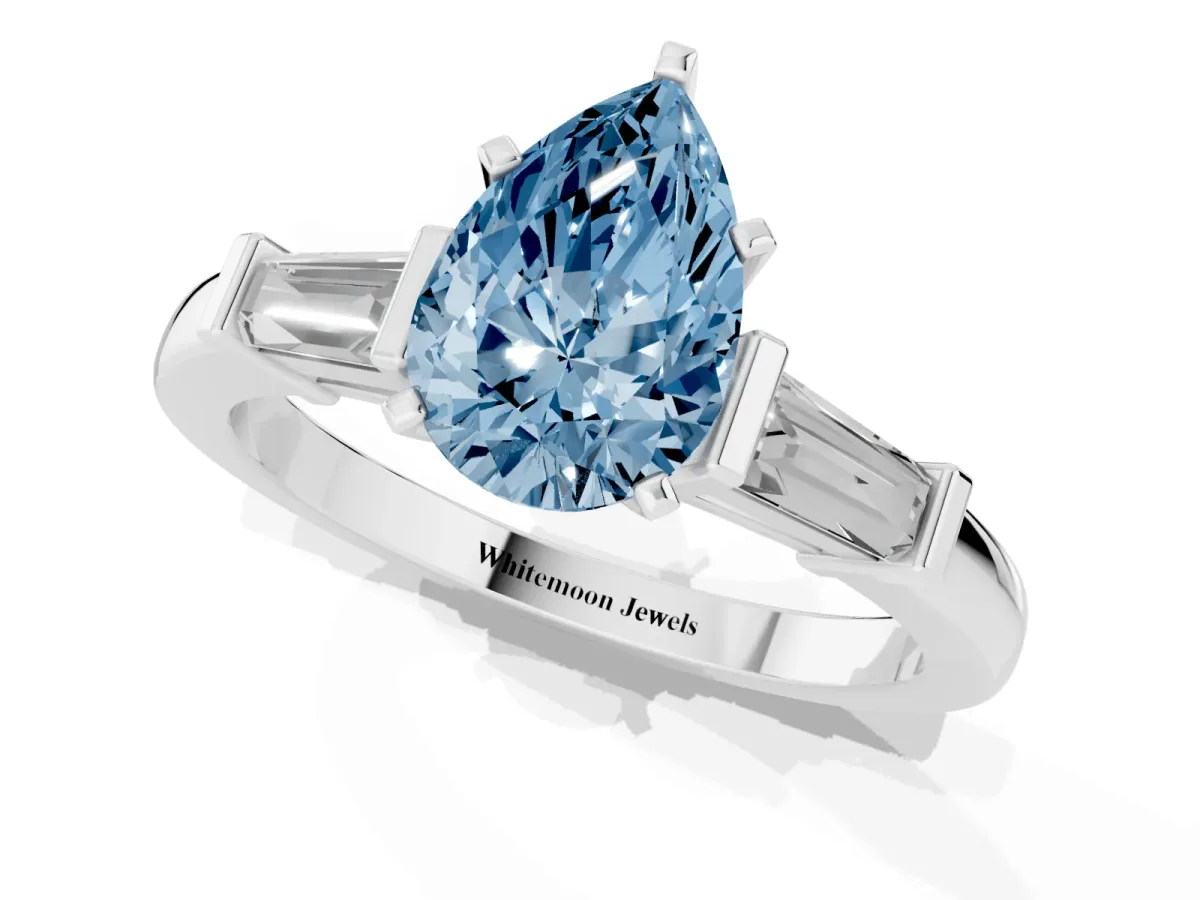 Fancy Blue Pear Cut Cut Diamond Solitaire Ring with Tapered Baguette Accents and Four-Prong Setting White gold