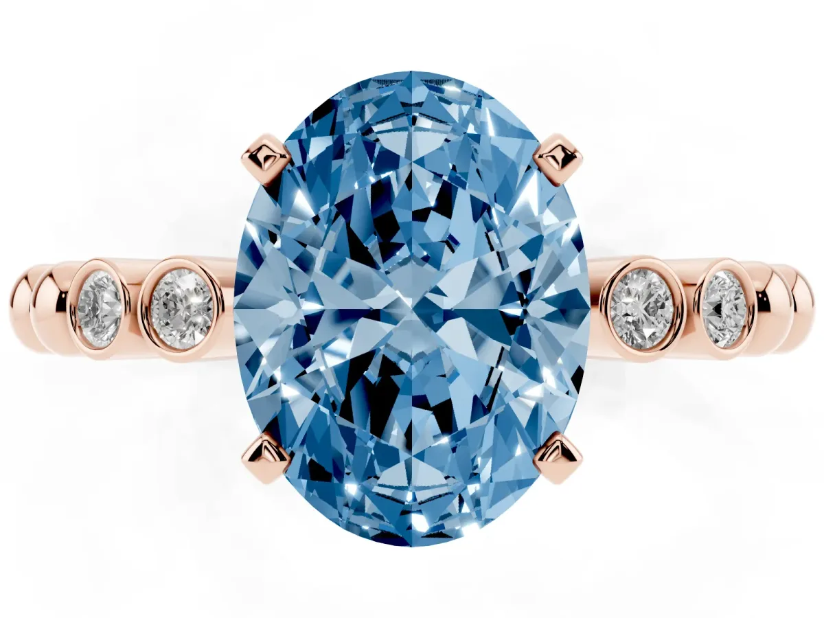 Fancy Blue Oval Cut Solitaire Bezel Accent Diamond Engagement Ring with Beaded Band and Four-Prong Setting Rose gold