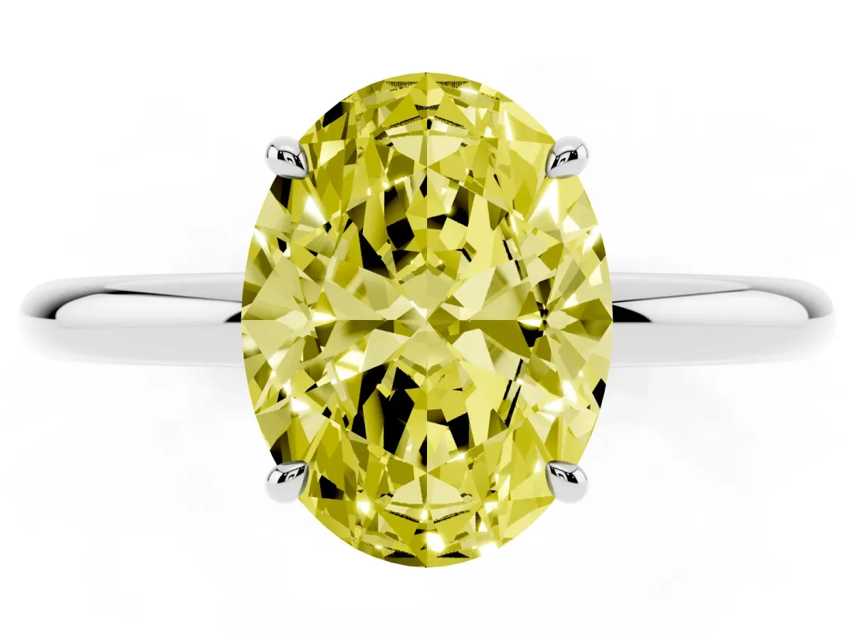 Fancy Yellow Oval Cut Diamond Solitaire Ring with Thin Band and Four-Prong Setting Silver