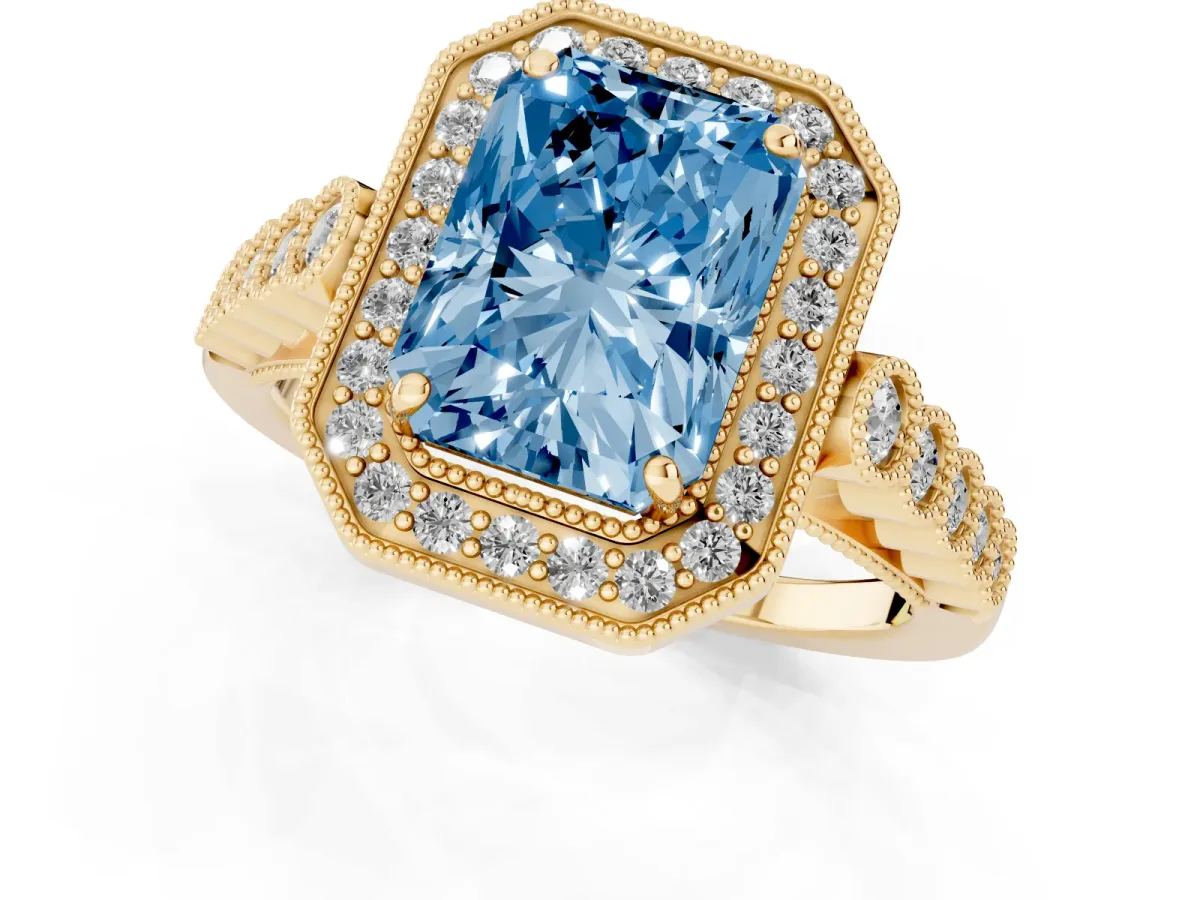 Fancy Blue Radiant Cut Halo Milgrain Solitaire with Bezel Set Side Stones and Pave Band Yellow gold