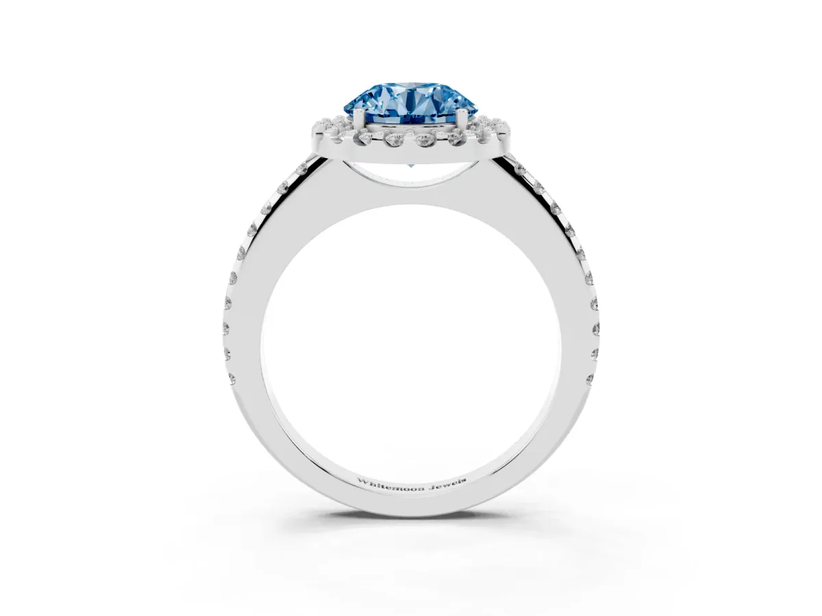 Fancy Blue Round Cut Diamond Pavé Halo Ring with Four-Prong Setting Platinum
