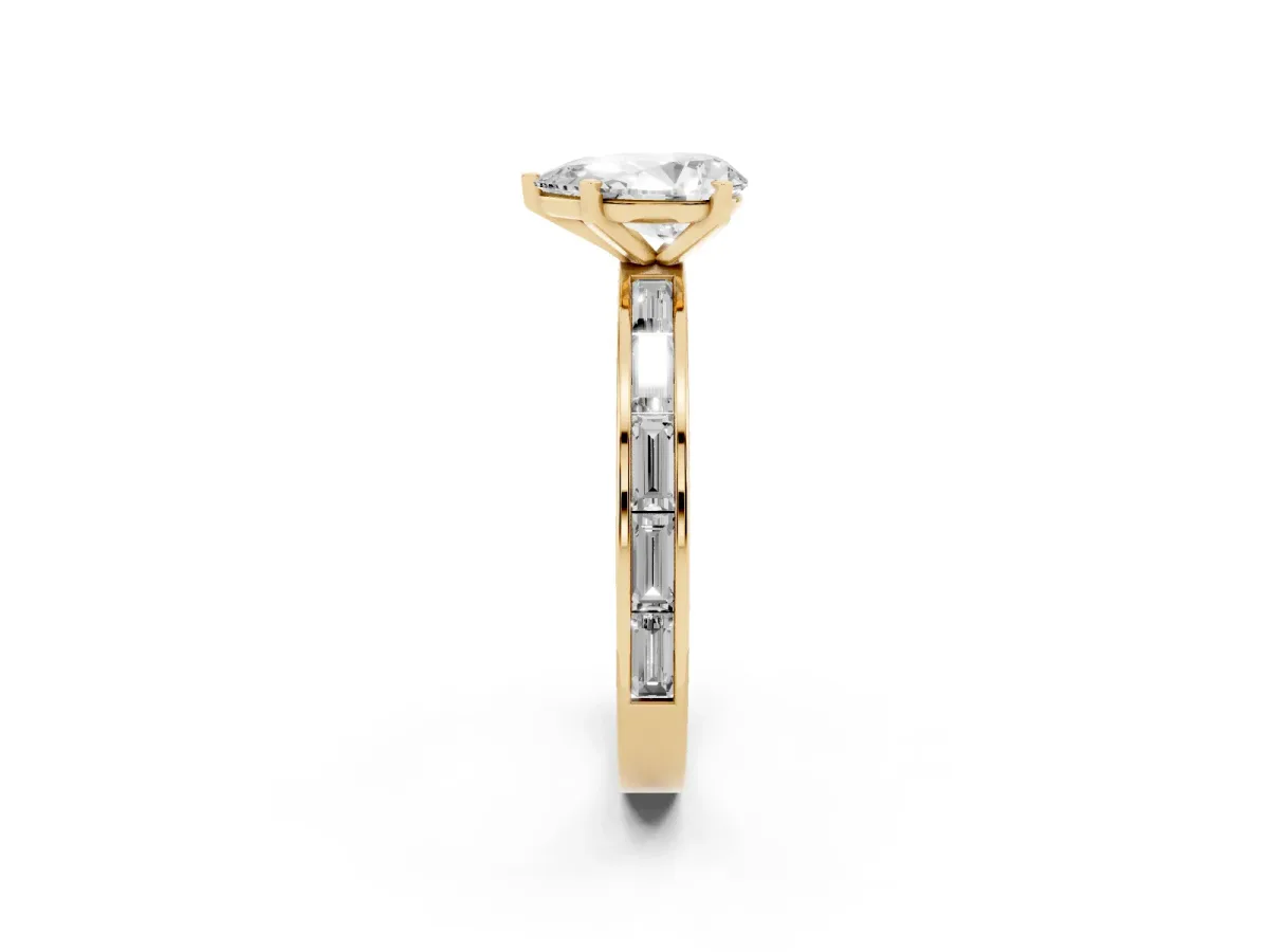 Pear Cut Solitaire Diamond Ring with Channel-Set Baguette Band and Four-Prong Setting Yellow gold