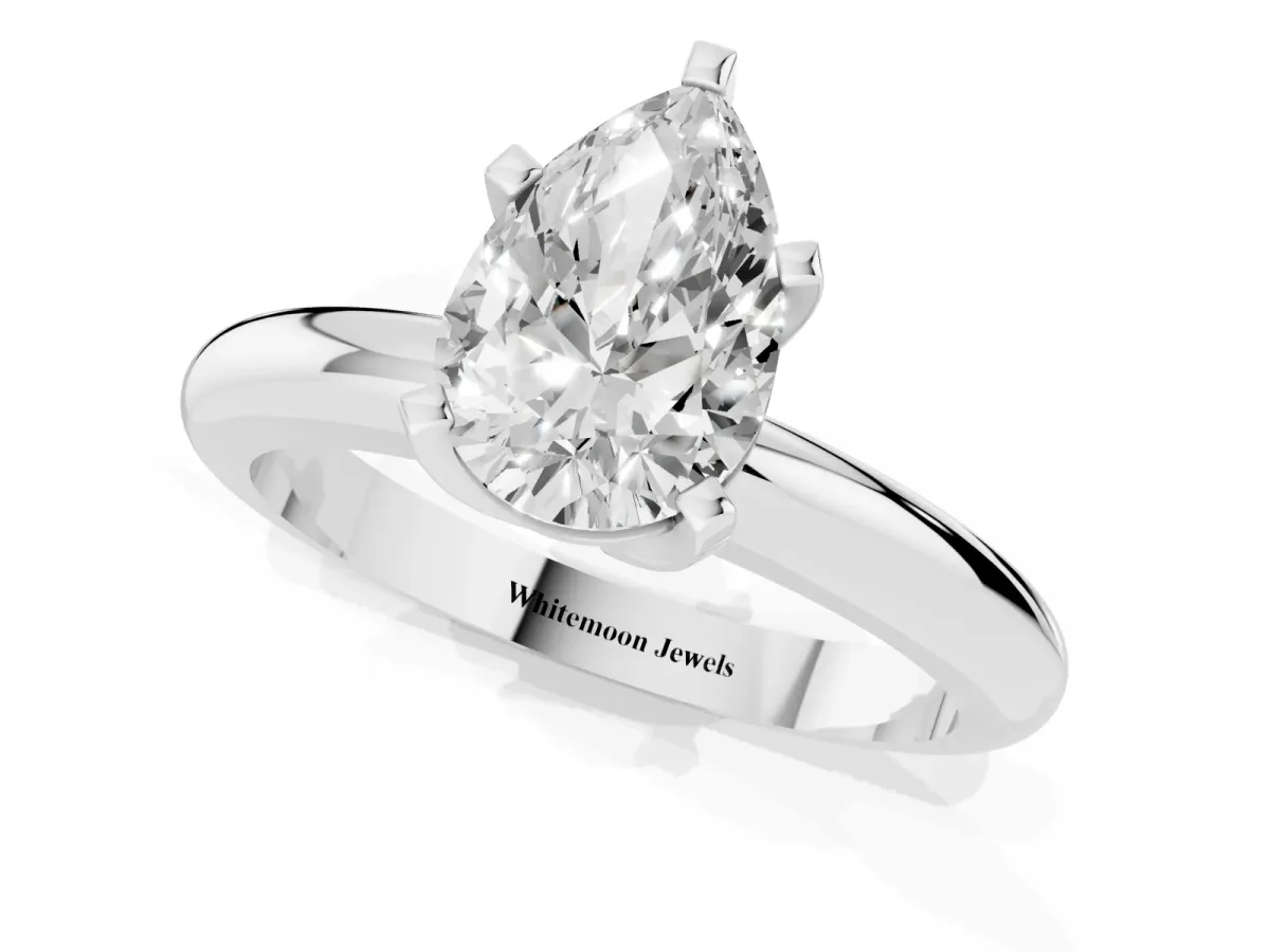 Pear Cut Diamond Solitaire Engagement Ring with Round Band and Four-Prong Setting White gold