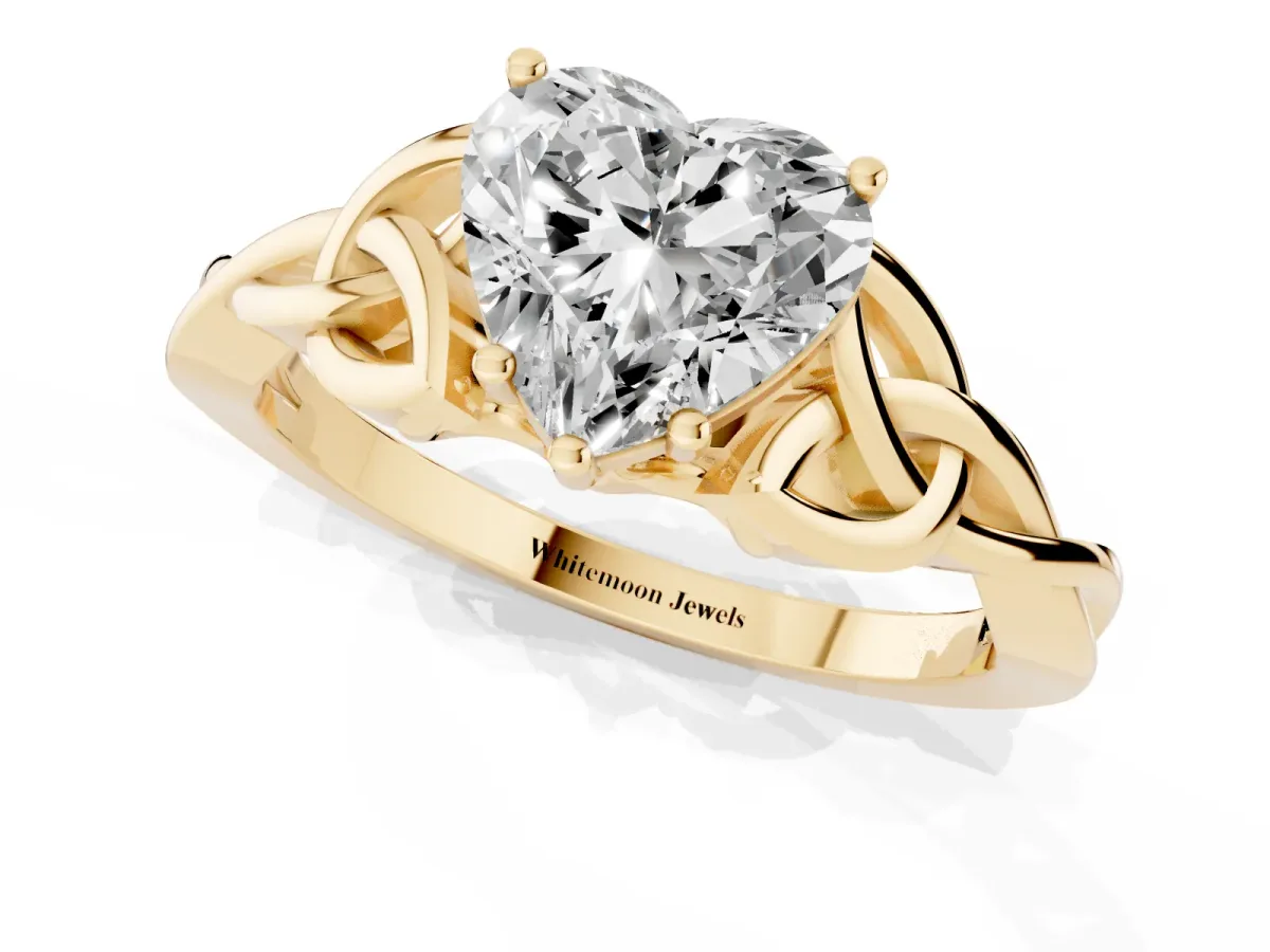 Heart Cut Diamond Solitaire Engagement Ring with Celtic Knot Band and Four-Prong Setting Yellow gold