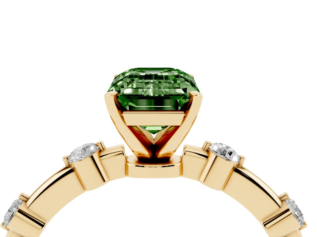 Fancy Green Emerald Cut Solitaire Diamond Ring with Bezel Set Side Stones and Prong Setting Yellow gold