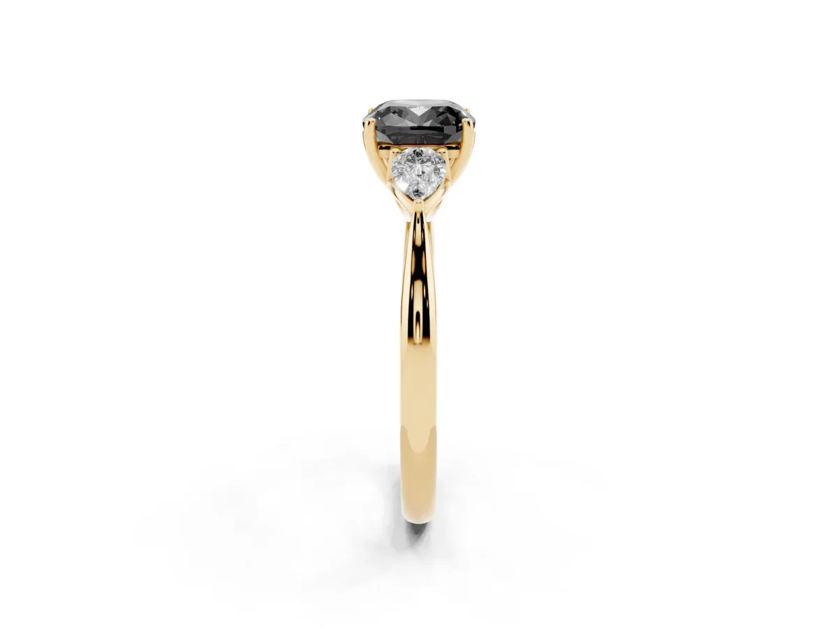 Fancy Black Cushion Cut Diamond Three-Stone Ring with Pear Side Stones and Prong Setting Yellow gold