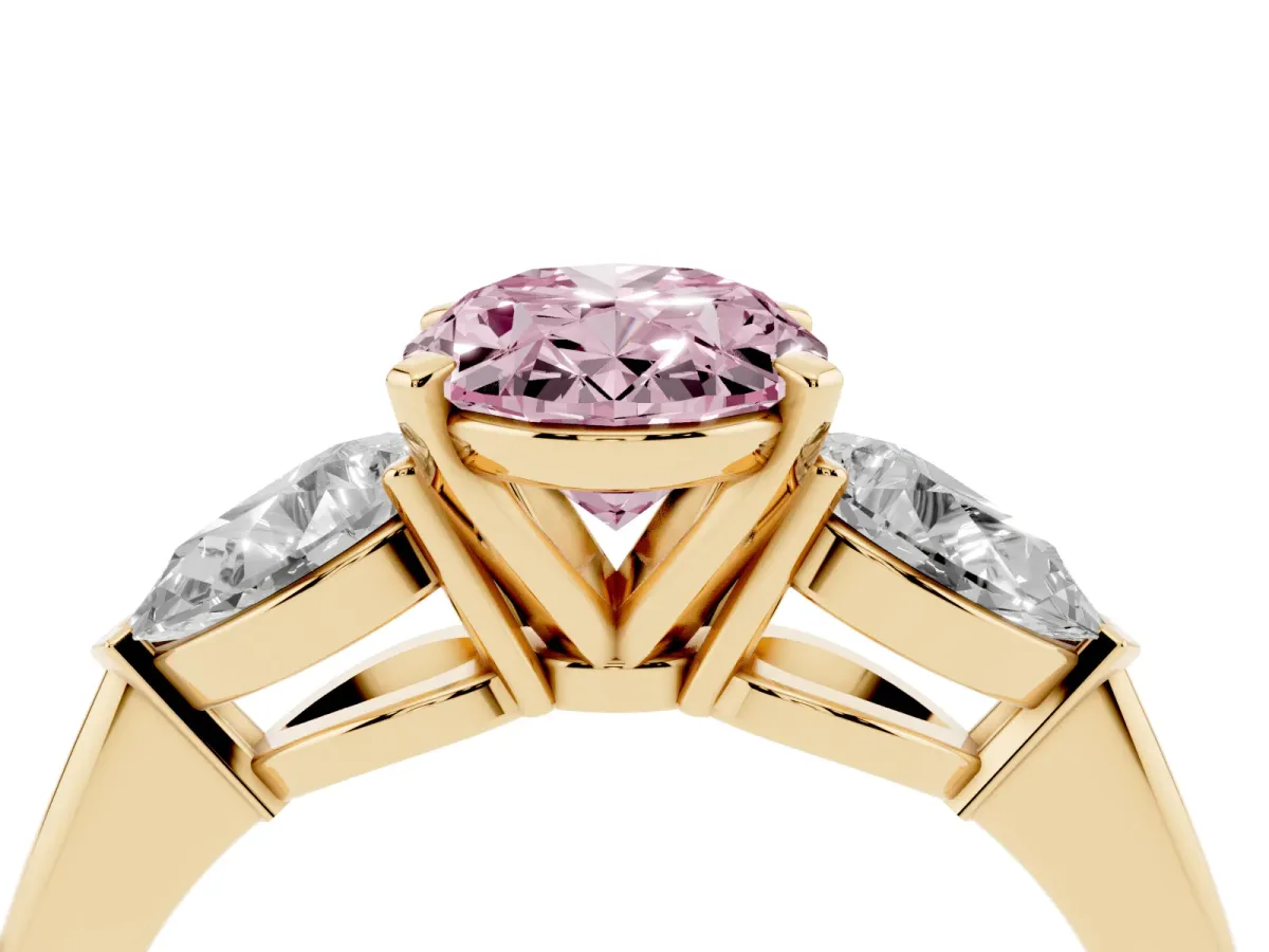 Fancy Pink Three-Stone Oval Cut Diamond Ring with Pear Side Stones and Four-Prong Setting Yellow gold
