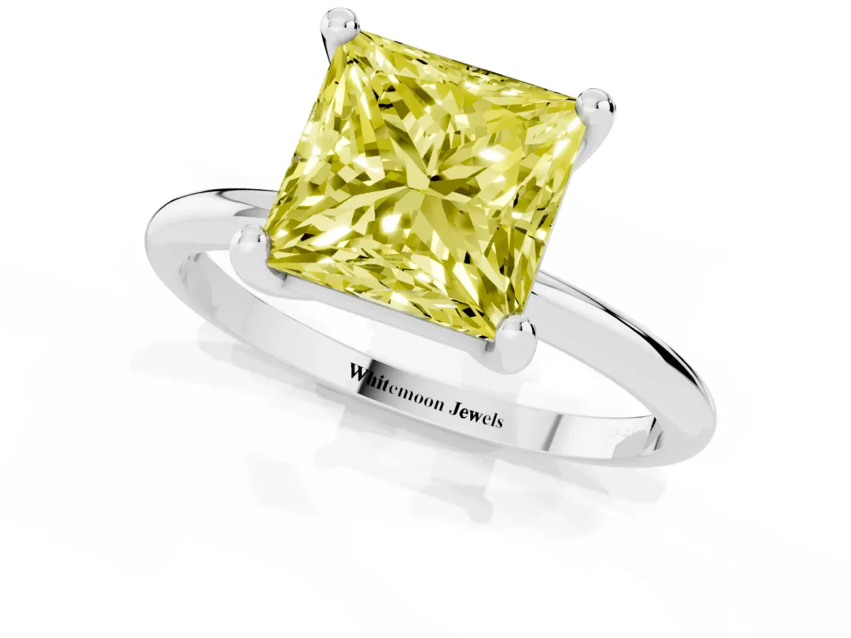 Fancy Yellow Princess Cut Solitaire Diamond Ring with 4-Prong Setting on a Classic Band Silver